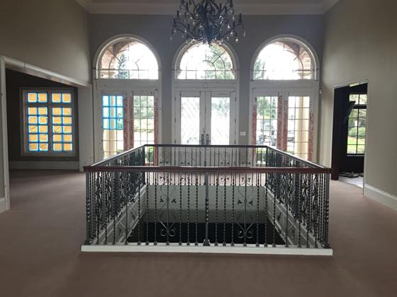 Curved & Grand Stairs project by NW Iron Works — scanned, laser-cut, and installed by our own crew