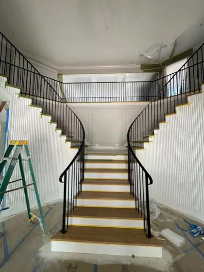 Curved & Grand Stairs project by NW Iron Works — scanned, laser-cut, and installed by our own crew
