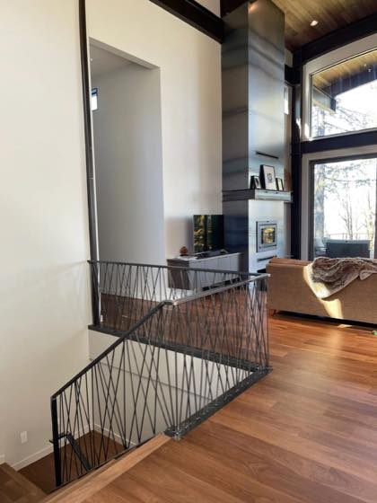 Curved & Grand Stairs project by NW Iron Works — scanned, laser-cut, and installed by our own crew
