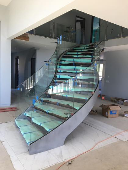Completed curved & grand stairs for a Clark County home