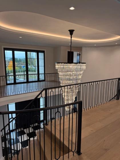 Curved & Grand Stairs fabricated and installed by NW Iron Works in the Portland-Vancouver metro