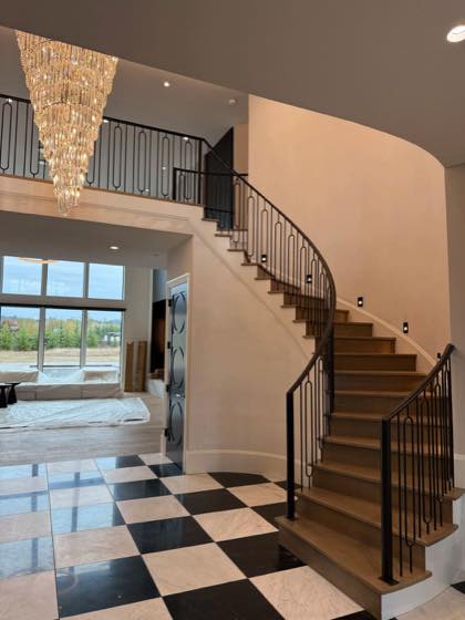 Curved & Grand Stairs project by NW Iron Works — scanned, laser-cut, and installed by our own crew