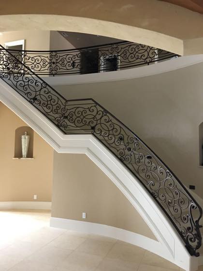 Curved & Grand Stairs fabricated and installed by NW Iron Works in the Portland-Vancouver metro