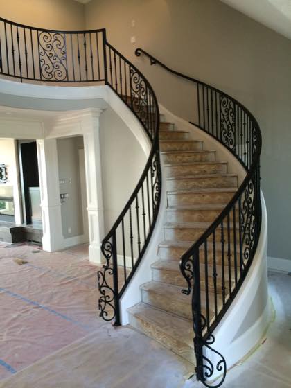 Curved & Grand Stairs fabricated and installed by NW Iron Works in the Portland-Vancouver metro