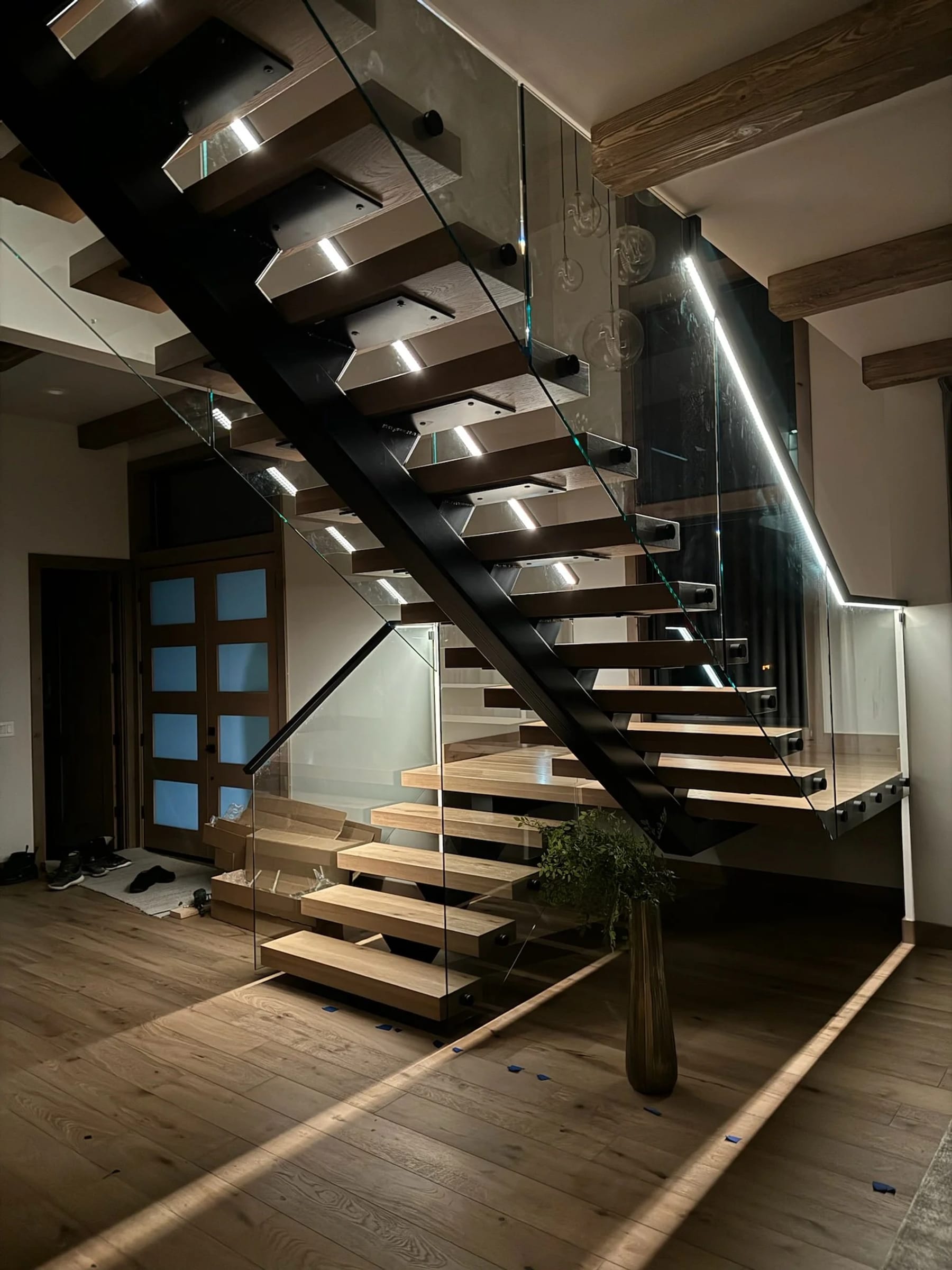 Custom glass floating staircase built by NW Iron Works, Vancouver WA